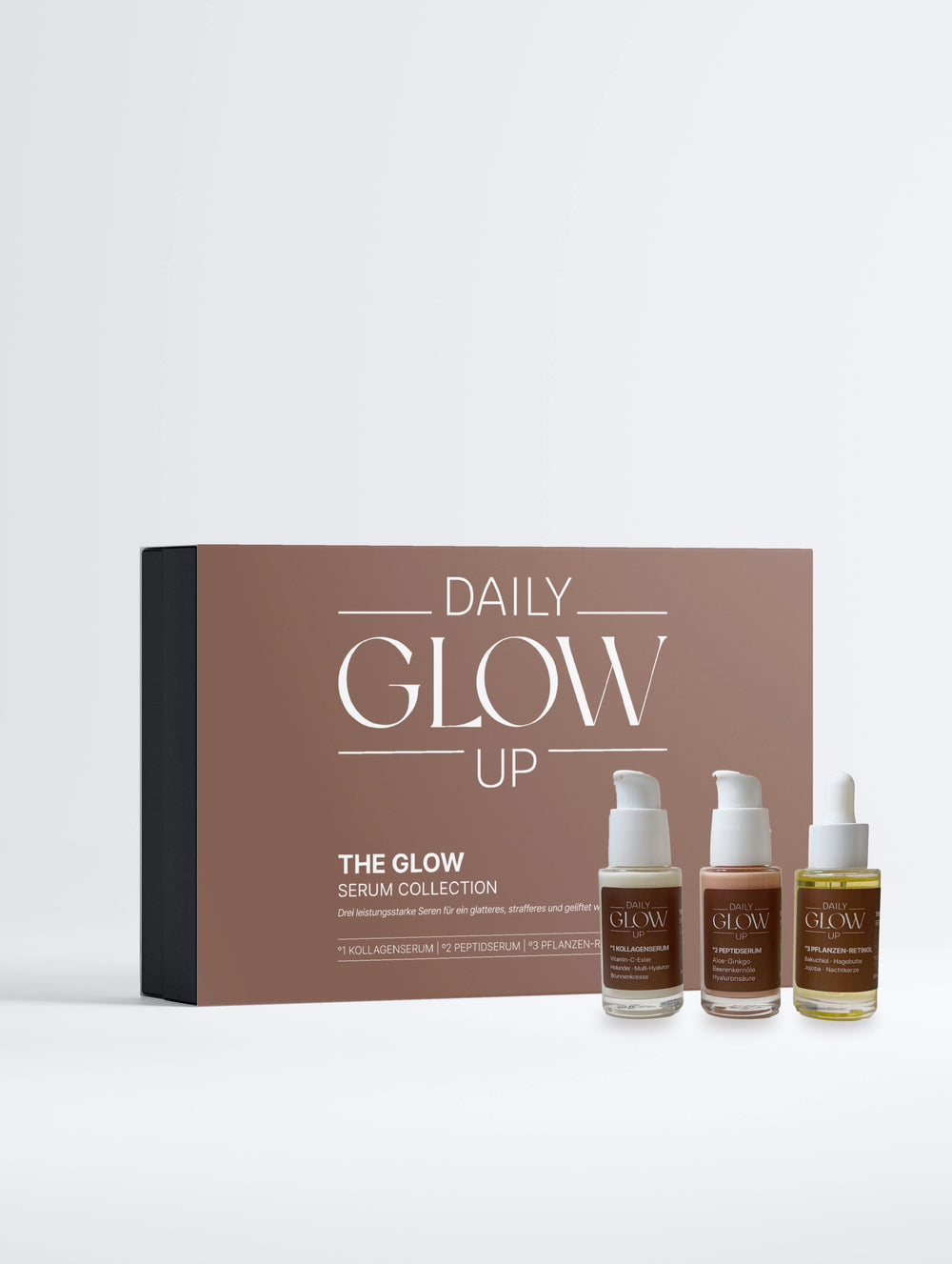 Daily Glow Up The Glow Serum Collection Box mit drei Seren für die abendliche Pflegeroutine.
